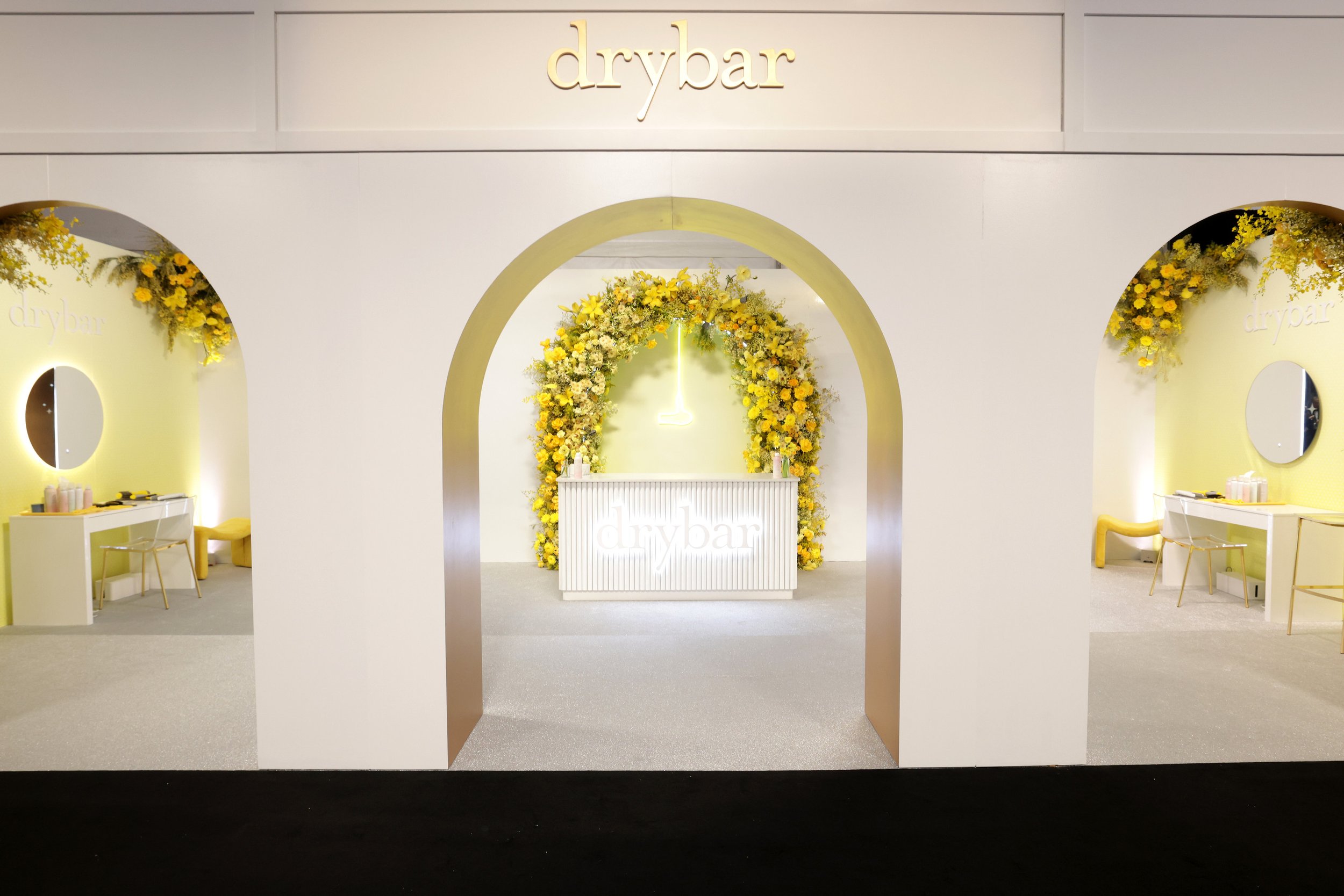 Large-scale yellow floral archway installation