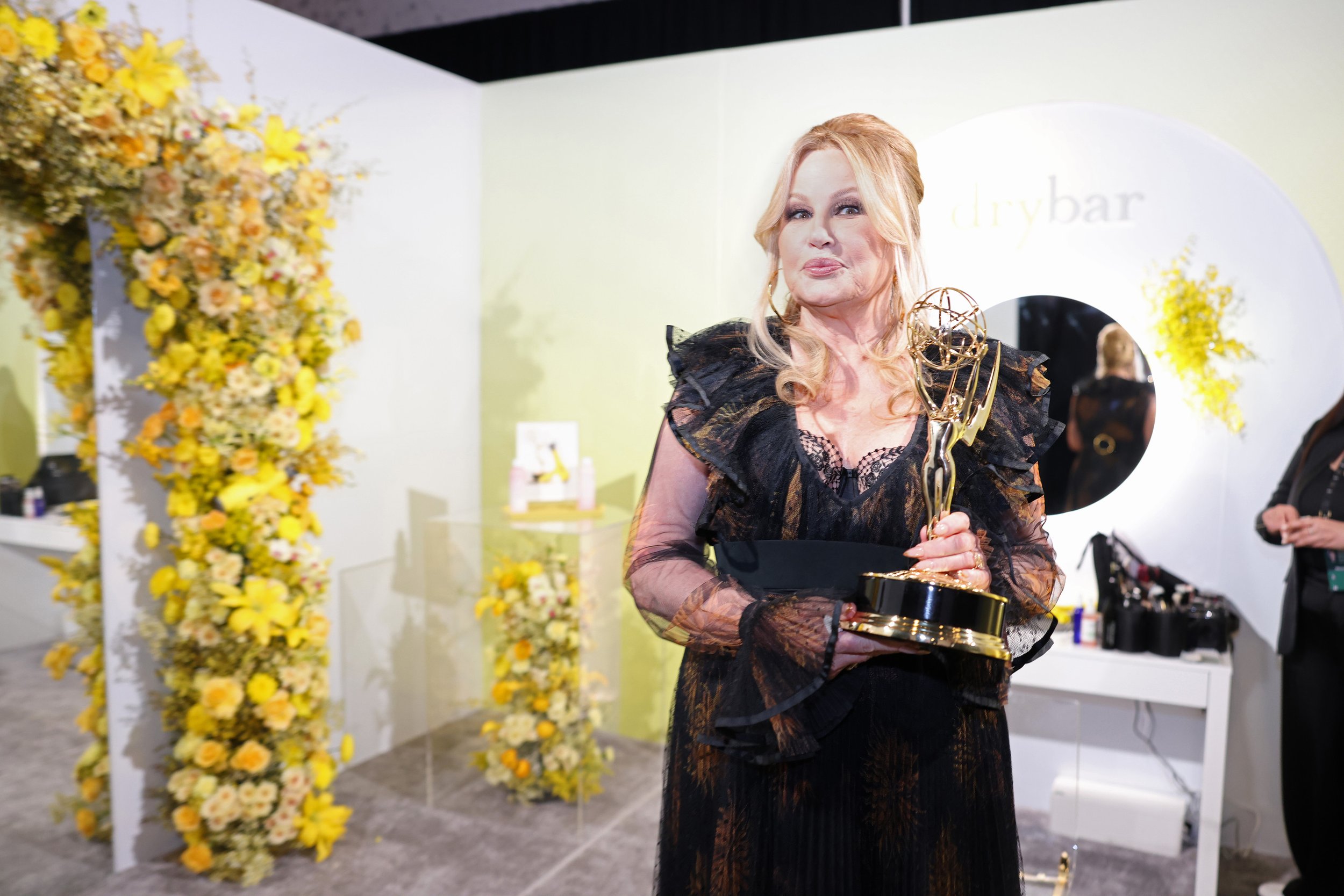 Guest amid a lush floral event installation